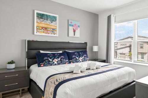a bedroom with a large bed and a window at 390 Strand Drive in Melbourne Beach