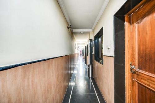 a corridor in a hospital room with a hallway at Hotel O Rourkela Palace in Raghunāthpāli