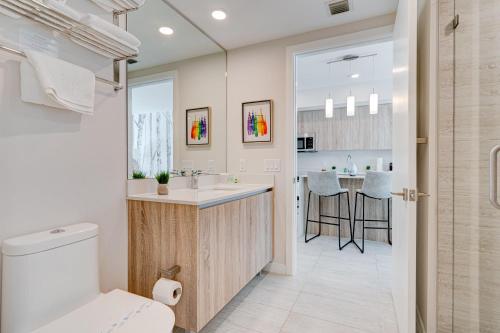 a bathroom with a toilet and a sink and a counter at 3900-719JC DESIGN DISTRICT, CONDO 1 BEDROOM /1 BATHROOM & BAYVIE in Miami
