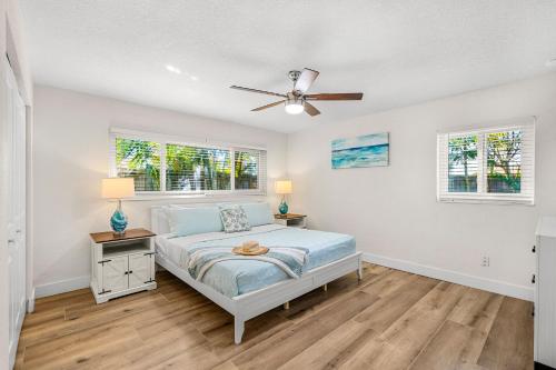 a bedroom with a bed and a ceiling fan at 121 Atlantic Blvd in Indian Harbour Beach