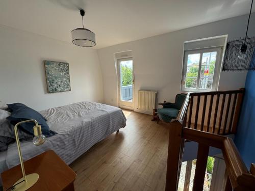 Postel nebo postele na pokoji v ubytování Charming appartement with roof terrace in Vittel