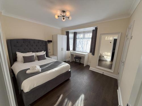 a bedroom with a large bed and a window at Apartment 20 @ Excel London in London