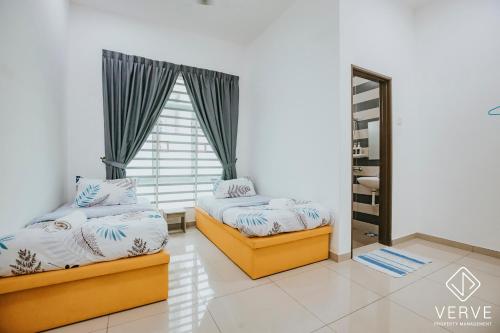 a bedroom with two beds and a window at Ipoh Gateway by Verve 4R4B - 14 Pax in Ipoh