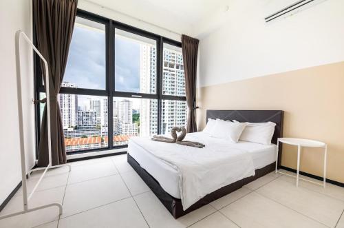 a bedroom with a bed and a large window at Urban Suites, Georgetown Penang - Near USM, Lam Wah EE in George Town