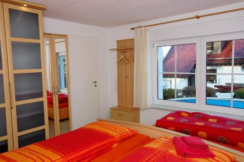 Ένα ή περισσότερα κρεβάτια σε δωμάτιο στο Gästehaus Gaens - Ferienhaus