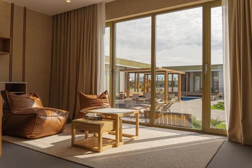 a living room with a couch and a table at Nammu Spa and Wellness in Dubun