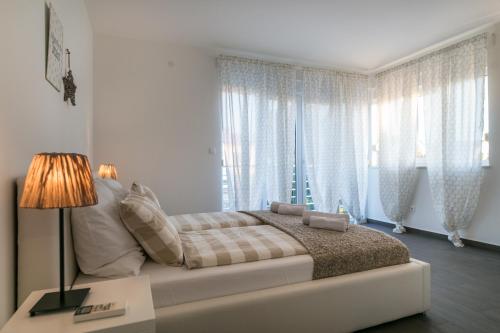 Postel nebo postele na pokoji v ubytování Villa Pjena