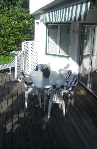 a white table and chairs on a porch at Ferienstudio Traunsee in Gmunden