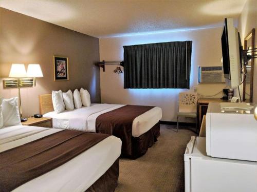 Ένα ή περισσότερα κρεβάτια σε δωμάτιο στο Americas Best Value Inn Torrington