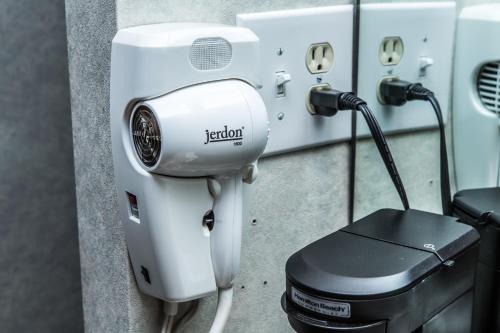 a white hair dryer sitting next to a machine at Pelican Inn in Monterey