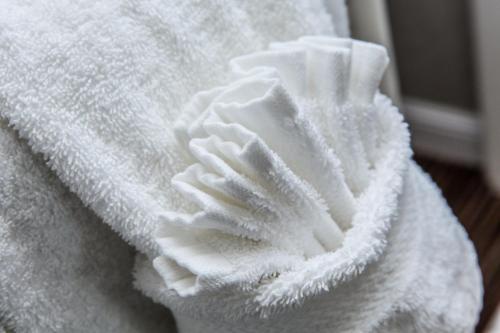 a white towel sitting on top of a table at Pelican Inn in Monterey