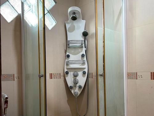 a shower head is attached to a wall at Vila Princess Sentul 7bedroom Private pool, Billiard, Tenis meja in Babakan Madang