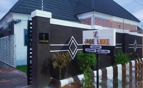 a house with a blade live sign in front of it at Jade Luxe 2 Bedroom Apartment in Agbor