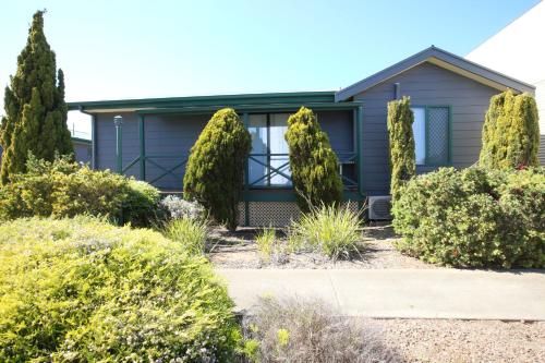 a house with trees in front of it at Port Lincoln Villas in Port Lincoln
