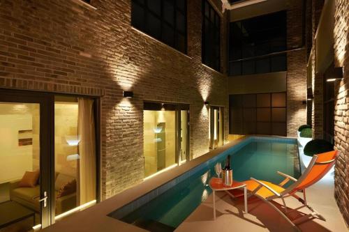 a swimming pool in the middle of a building at The Classic by Hotelone in Jeonju