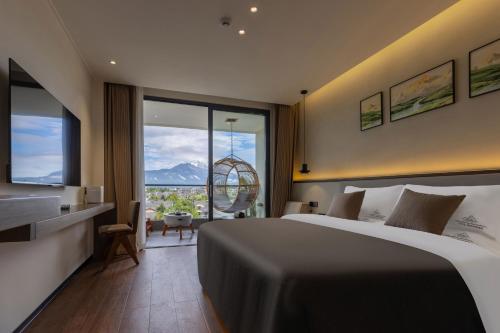 a hotel room with a bed and a large window at Shanyujin Dellar Wild Luxury Hotel Luxury Mountain Retreat in Lijiang
