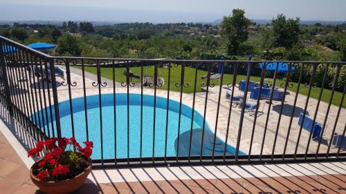 a view of a swimming pool from a balcony at Antico Borgo Petralia in Zafferana Etnea