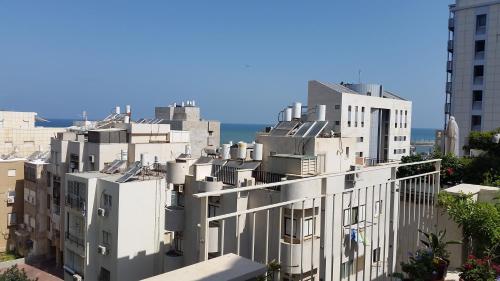 a group of white buildings in a city at Tel Aviv Roof Apartment in Tel Aviv