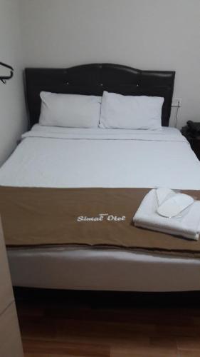 Postel nebo postele na pokoji v ubytování Simal Butik Hotel