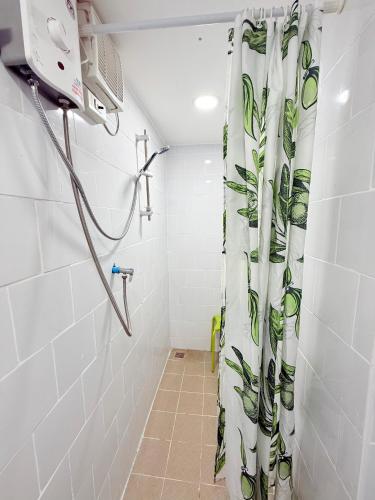 a shower curtain in a bathroom with a shower at Harry's Beach Club in Ban Phe
