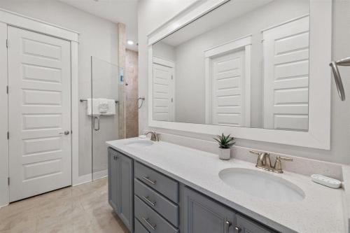 a bathroom with a sink and a mirror at Isle be 'SEA'ing You in Inlet Beach