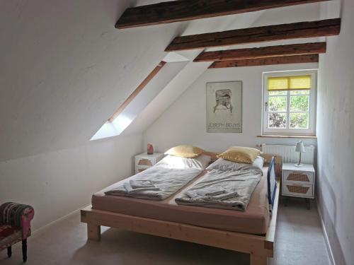 a bedroom with a bed and a window at Ferienwohnung Ostermaier in Dresden