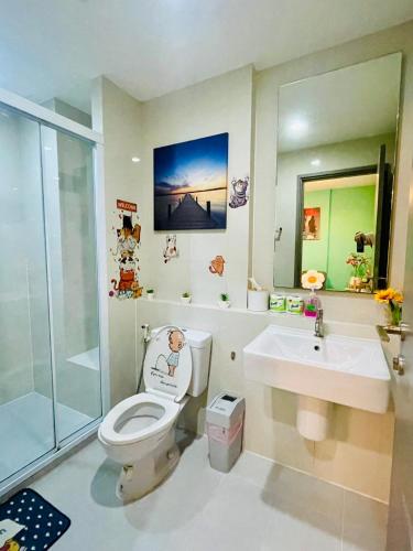 a bathroom with a toilet and a sink at The base Central 1006 by Numam in Pattaya