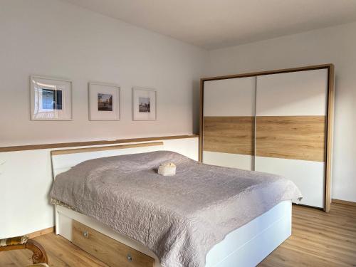 a bedroom with a bed and a large mirror at Artinea in Gorizia