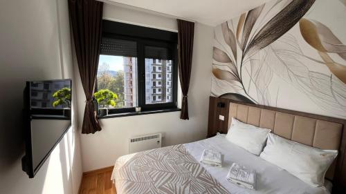 Ένα ή περισσότερα κρεβάτια σε δωμάτιο στο Avalon Titova Vila