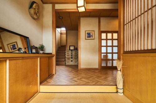 a hallway of a house with wooden floors at Traditional Japanese House, MtFuji view ,Free bag ,4 bedrooms ,Rent bike in Fujiyoshida