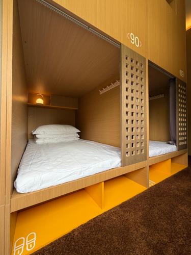 Ένα ή περισσότερα κρεβάτια σε δωμάτιο στο Only Female WOPING HOTEL GUANGZHOU TAIKOO