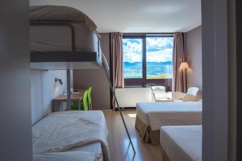 Postel nebo postele na pokoji v ubytování Campus Cerdanya