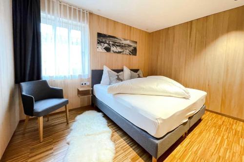 Ένα ή περισσότερα κρεβάτια σε δωμάτιο στο ALPtyrol-Sennerei