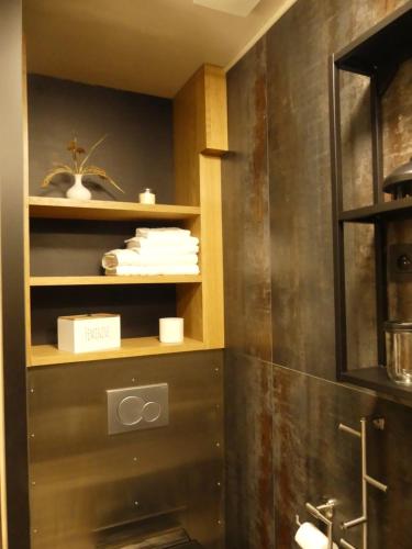 a bathroom with a shower and a sink in a room at OrigiNell - EmotioNell B&B in Ouffet
