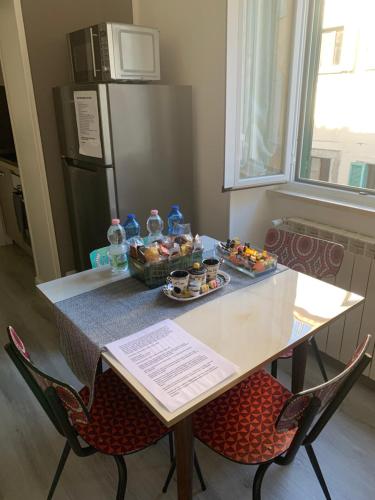 a table with a tray of food on it at Casa Flavia-Residenza nel cuore di Ariccia in Ariccia