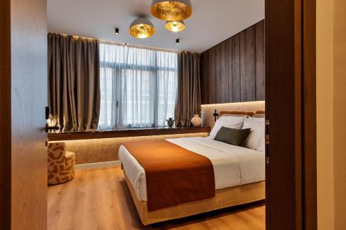 Ένα ή περισσότερα κρεβάτια σε δωμάτιο στο Acropolis Grid Athens