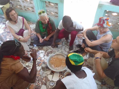 a group of people sitting on the floor at Jallo Kurundingoto Eco Tourist Camp in Nyofelleh