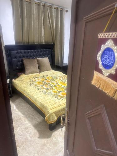 a bedroom with a bed and a door to a room at Arabian luxury Farmhouse Oasis Private & Cozy 