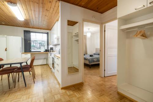a kitchen and dining room with a table and chairs at Liam's Villa in Rovaniemi