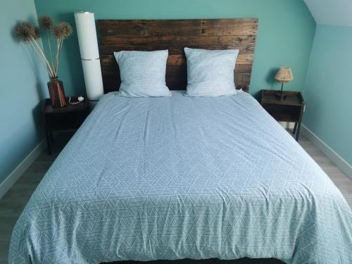 En eller flere senge i et værelse på Villa Les Pélicans