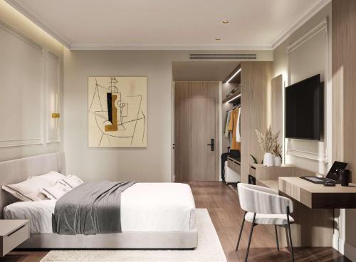 a bedroom with a bed and a desk and a television at Hotel By Holiday in Rinas