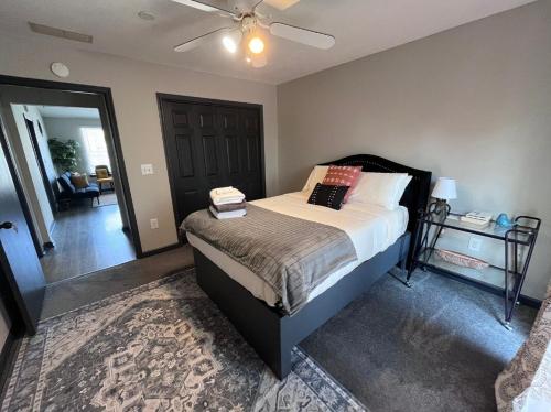 a bedroom with a bed and a ceiling fan at The Coffee House in Lexington
