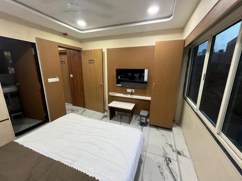 Μια τηλεόραση ή/και κέντρο ψυχαγωγίας στο Hotel Nexon Inn