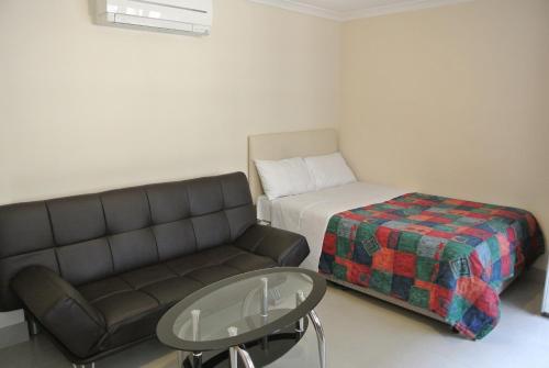 A bed or beds in a room at Seven Dials Apartments Bedford Street