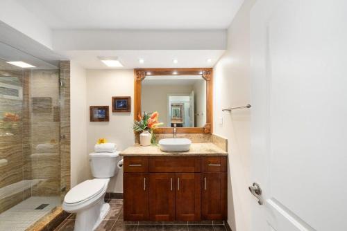 a bathroom with a toilet and a sink and a shower at Lahaina Shores 512 · LS 512 Getaway Studio by the Beach Pool Hot in Lahaina