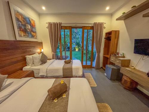 Ένα ή περισσότερα κρεβάτια σε δωμάτιο στο Singabu Bungalows