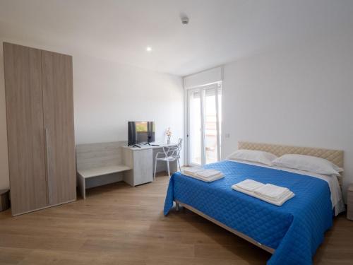 Postel nebo postele na pokoji v ubytování Essenza Rooms