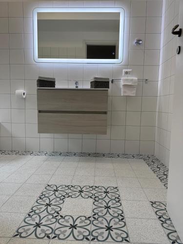 a bathroom with a sink and a mirror on the wall at B&B Casa Lydia in Lamezia Terme
