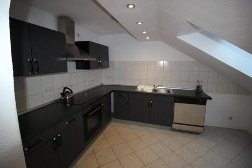 Kuchyň nebo kuchyňský kout v ubytování Apartmenthaus Wertheim