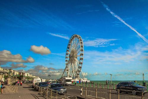 a ferris wheel in the middle of a city at Dudy Studios At Brighton City Center in Brighton & Hove